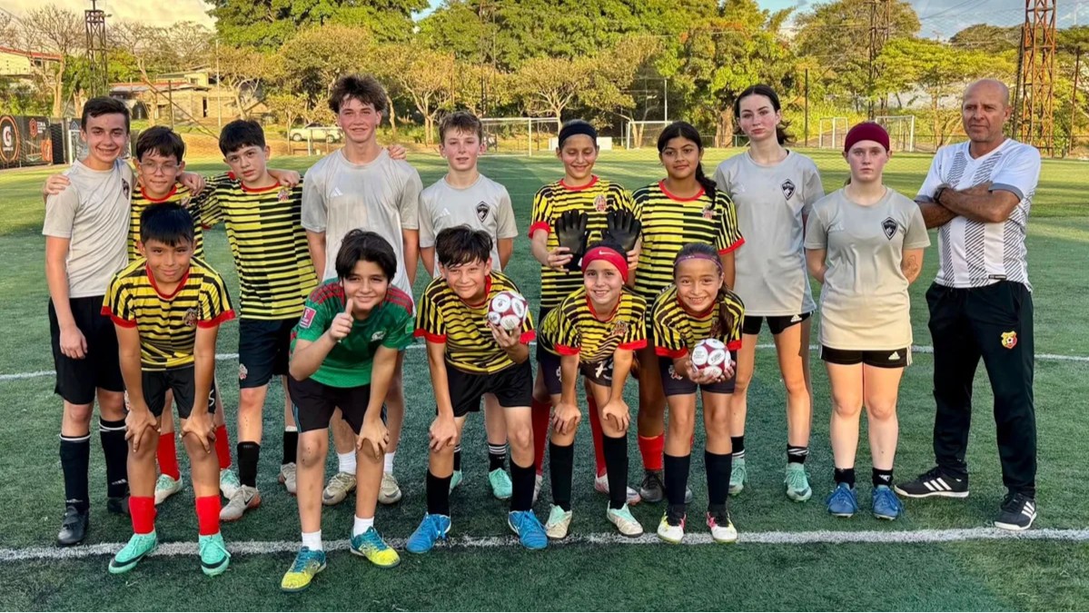 A Storm youth soccer team poses for a group photo on a field during an international trip to Costa Rica 1