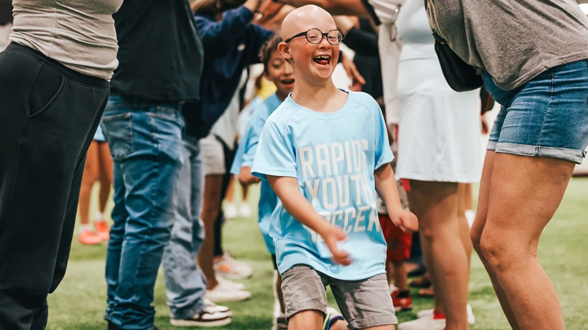 Adaptive soccer player running through tunnel