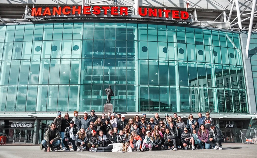 Colorado Storm international travel group posing in front of Old Trafford stadium in Manchester England 2