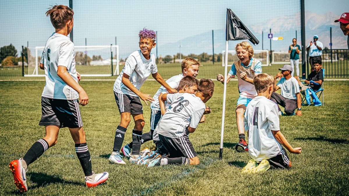 Pre Elite boys celebrating a soccer goal