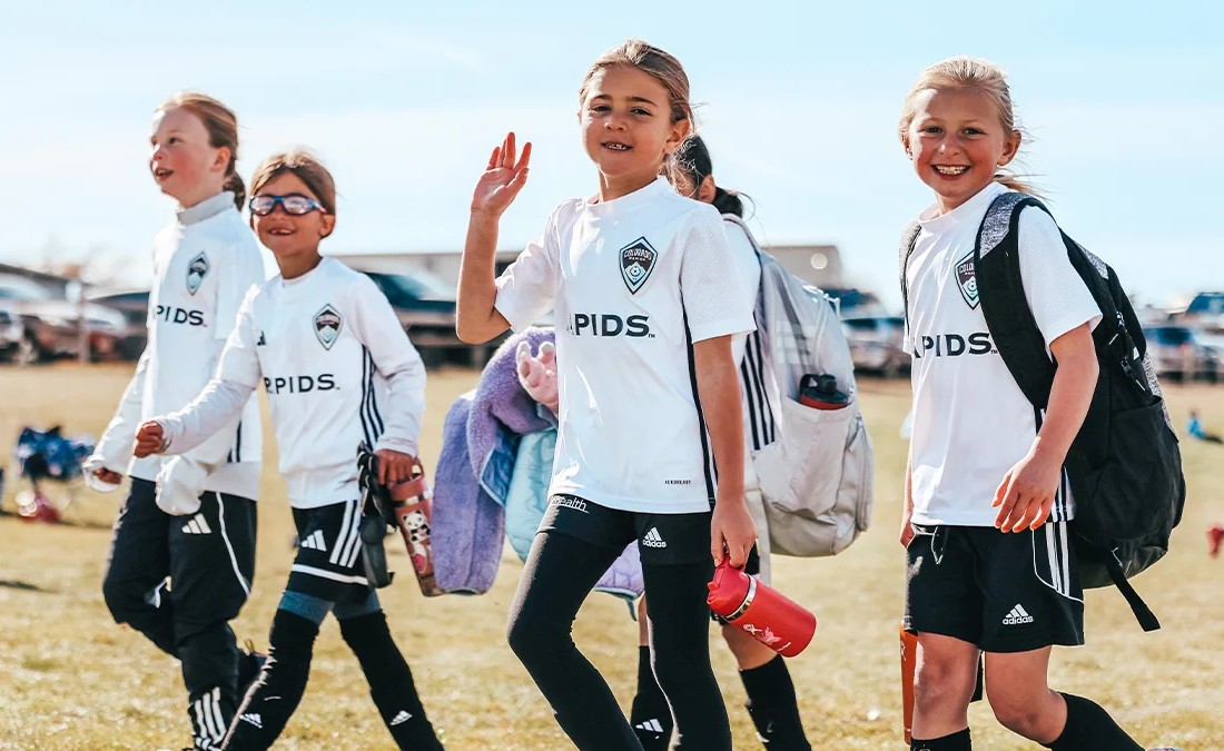 Young girls soccer players walking onto the field for a game at a Colorado tournament