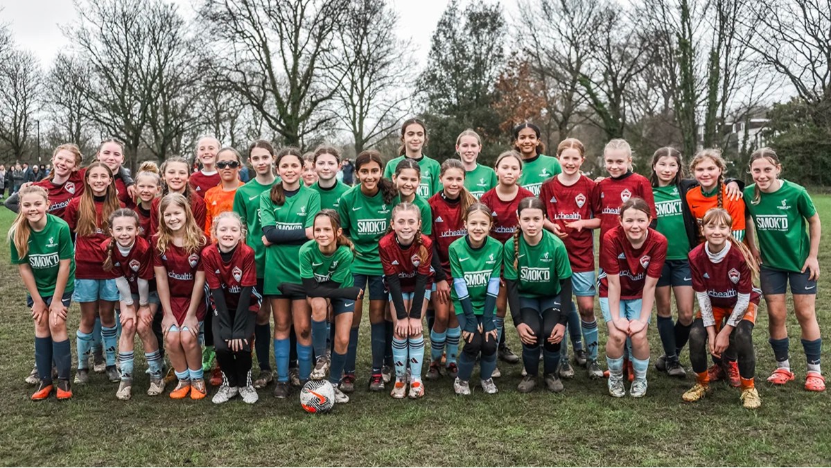 Youth girls soccer players from Colorado Storm and a local English club after a friendly match in England 1