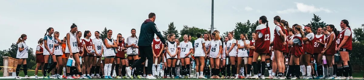 Youth girls soccer players gathering for a summer ID camp session with a Storm coach in Denver 2