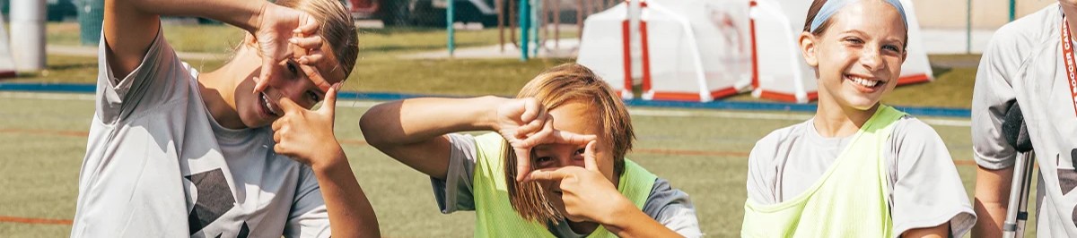 youth soccer players making hand frames during fun team activities in denver colorado
